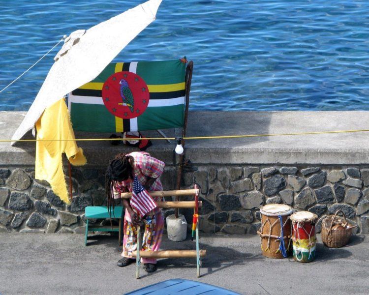 Man setting up his souvenir booth in Roseau Dominica