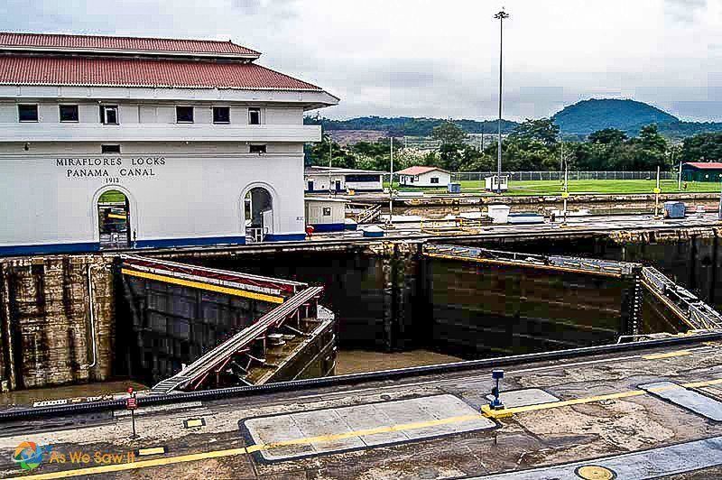 Control building at Panama Canal. Sign on building says Miraflores Locks Panama Canal