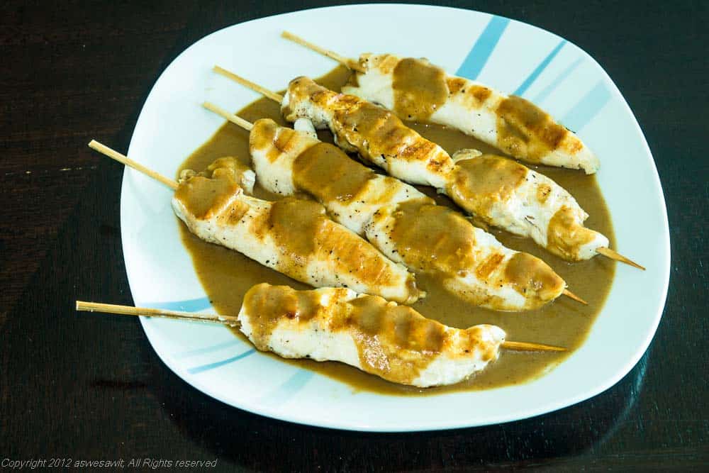 Homemade satay sauce served on grilled chicken