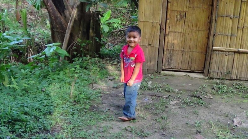 Smiling Kichwa boy, with red t-shirt