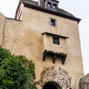 Marksburg castle gate with text overlay that says marksburg castle