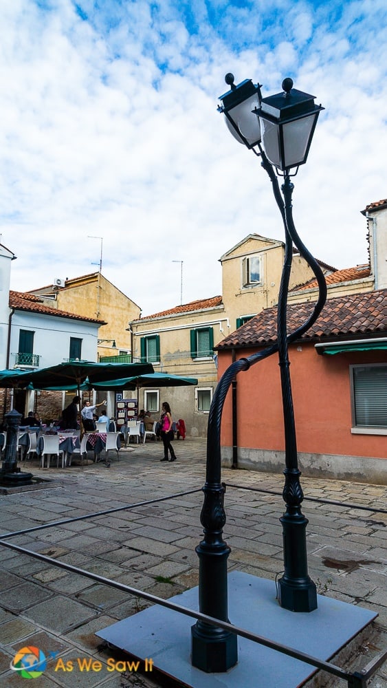 Quirky twisted lampposts on display as art on Murano island