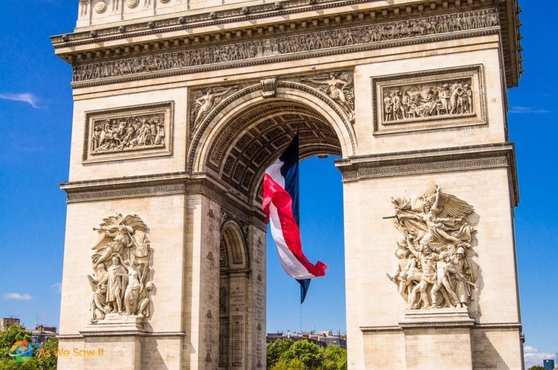 French flag draped beneath the Arc de Triomphe in Paris France