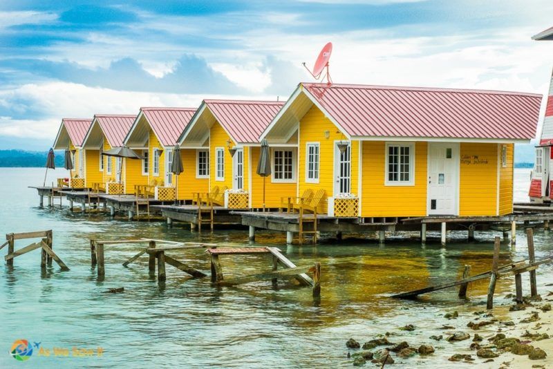 Isla Carenero Panama hotel with brilliant yellow and red cabanas