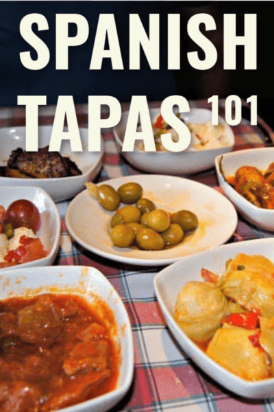 small plates of tapas on red check tablecloth, text overlay says "spanish tapas 101"