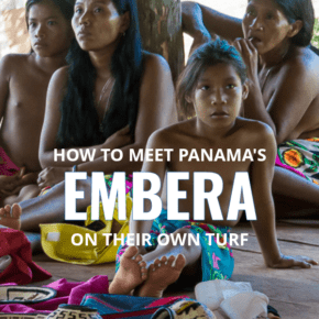 Four Embera women sit with their baskets during a tour of their village in Panama.