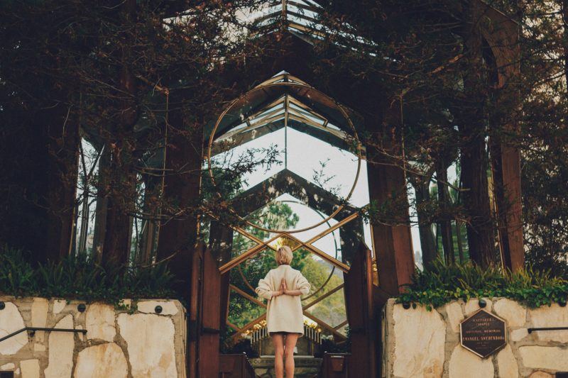 oman standing under an arbor in Goa India