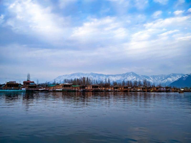 Snow capped mountains behind Dal Lake in November