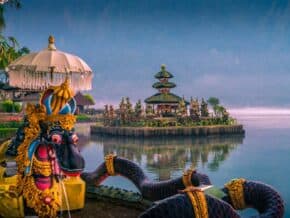 Ulun Danu Beratan in lake in Bedugul Indonesia. .Colorful statue in foreground