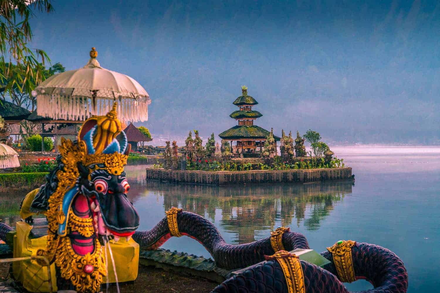 Ulun Danu Beratan in lake in Bedugul Indonesia. .Colorful statue in foreground