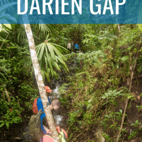 travelers blazing a trail through the rain forest text says crossing the darien gap