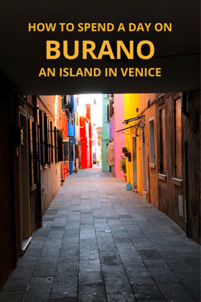 Colorful houses line a sidewalk in Burano Italy. Text Overlay says How to Spend a day in Burano an Island in Venice