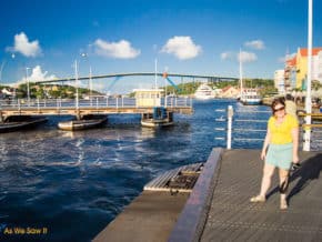 View from Queen Emma pontoon bridge, looking at queen juliana, a high bridge in the backgrouind