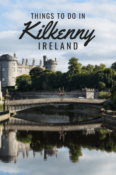 Kilkenny Castle seen from the river. Text overlay says Things to do in Kilkenny Ireland.