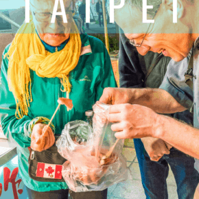 couple eating street food text says taipei