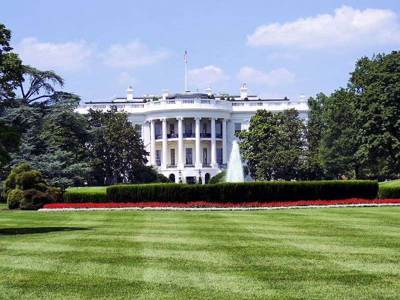 Classic view of the White House columns with fountain in front