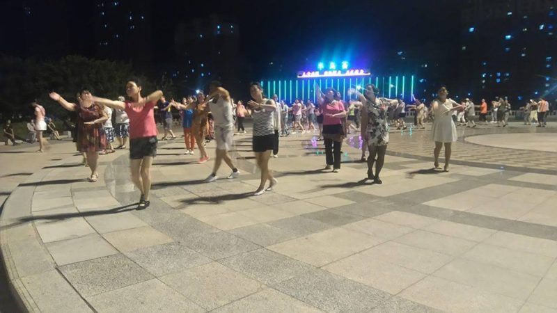 Chinese people dancing together