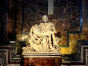 Michelangelo's Pieta statue of Mary holds the dead body of Jesus