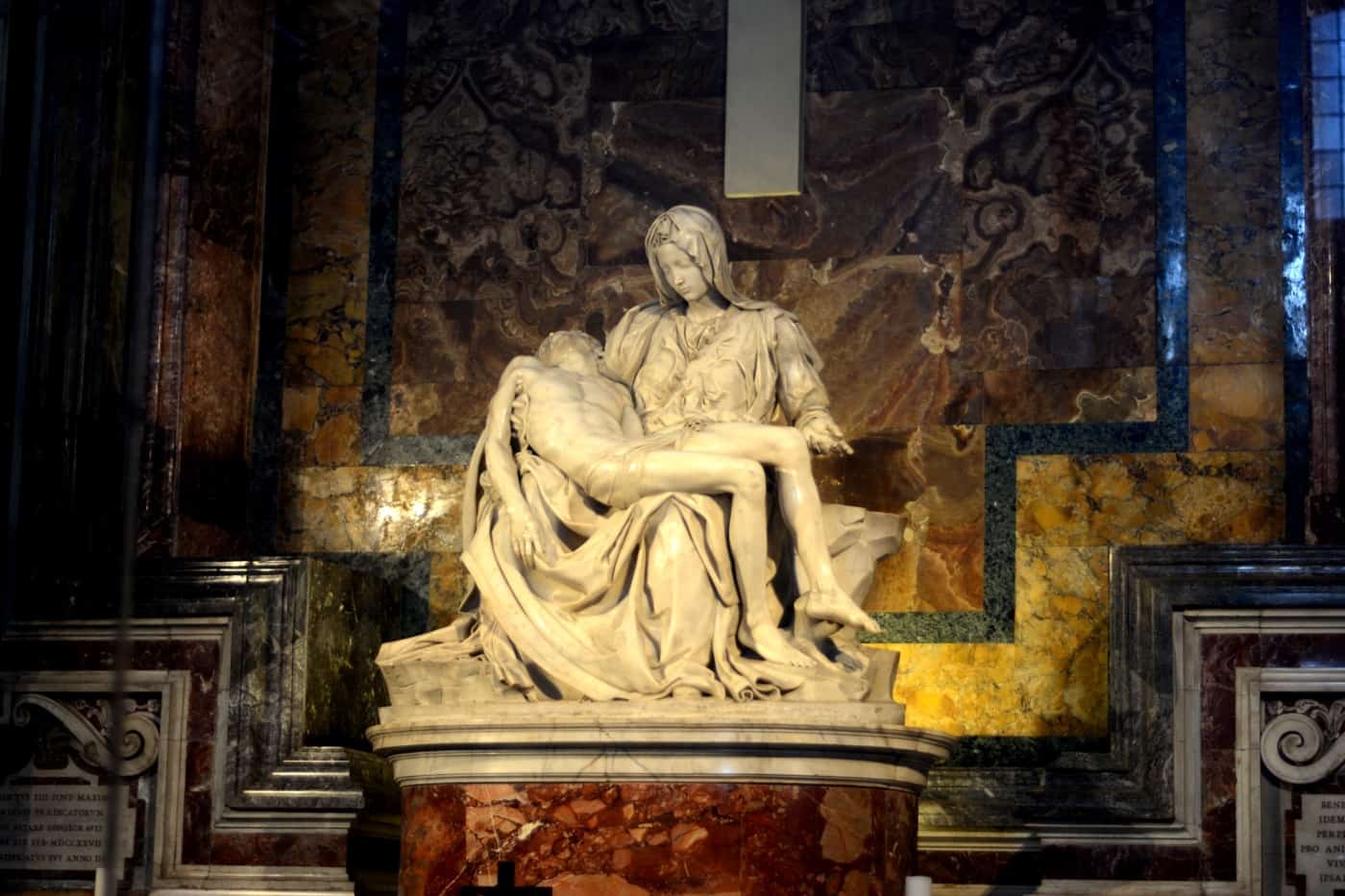 Michelangelo's Pieta statue of Mary holds the dead body of Jesus