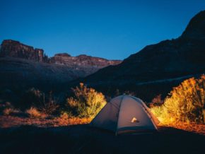 tent surrounded by mountains