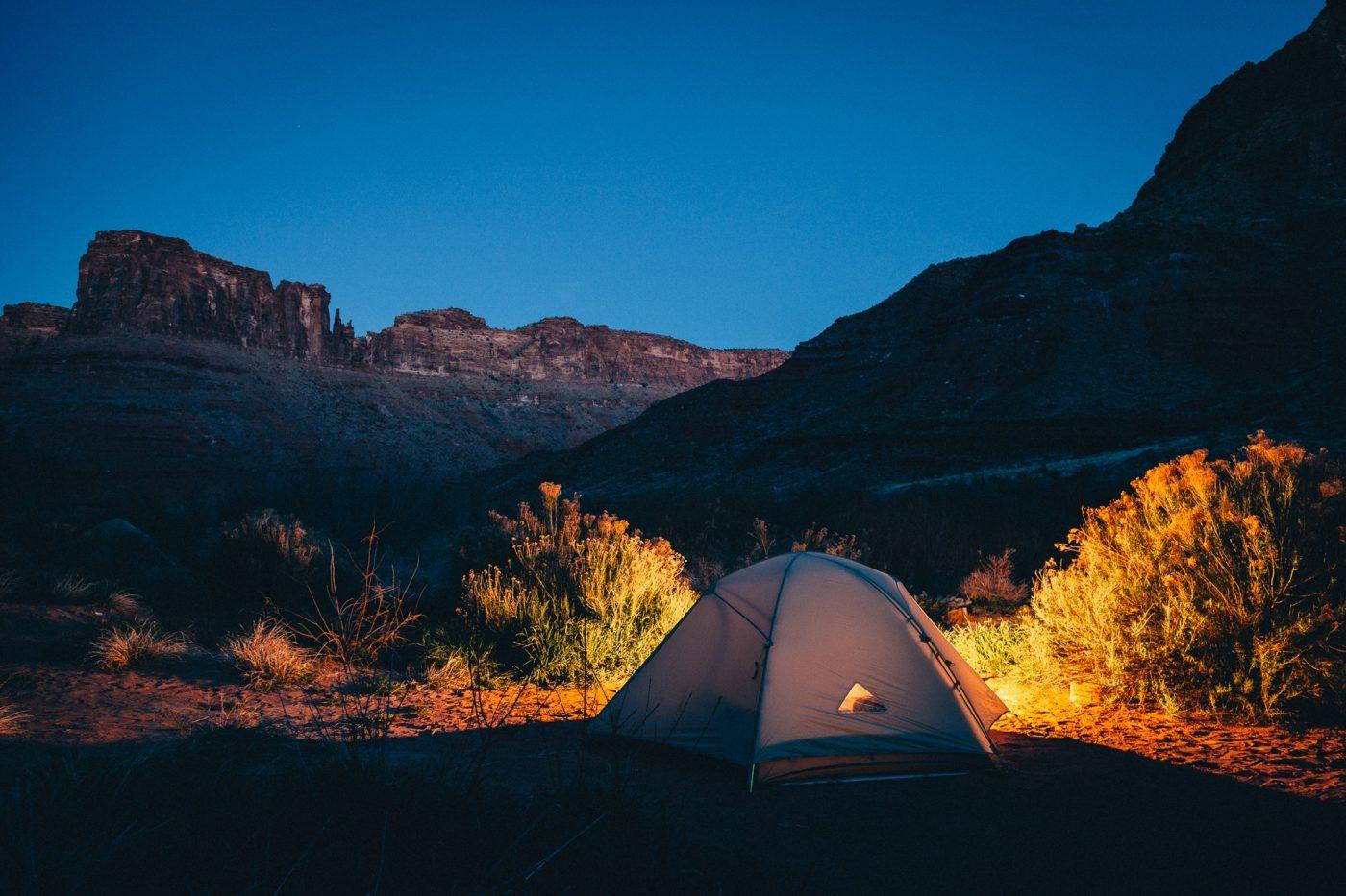 tent surrounded by mountains