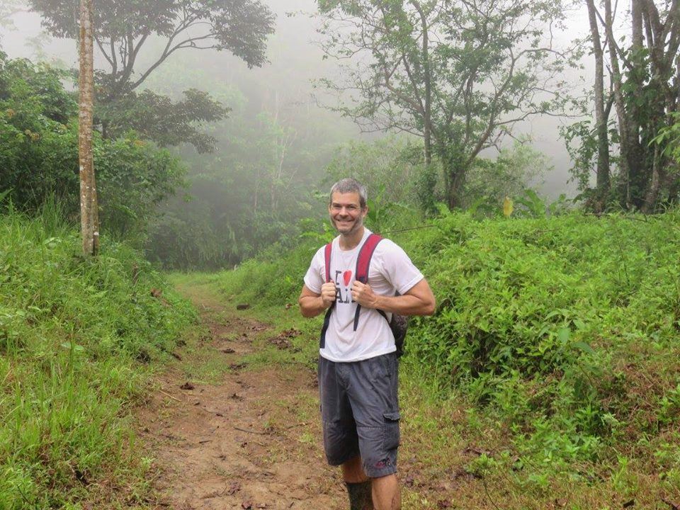 Ryan on a dirt path, wearing a backpack