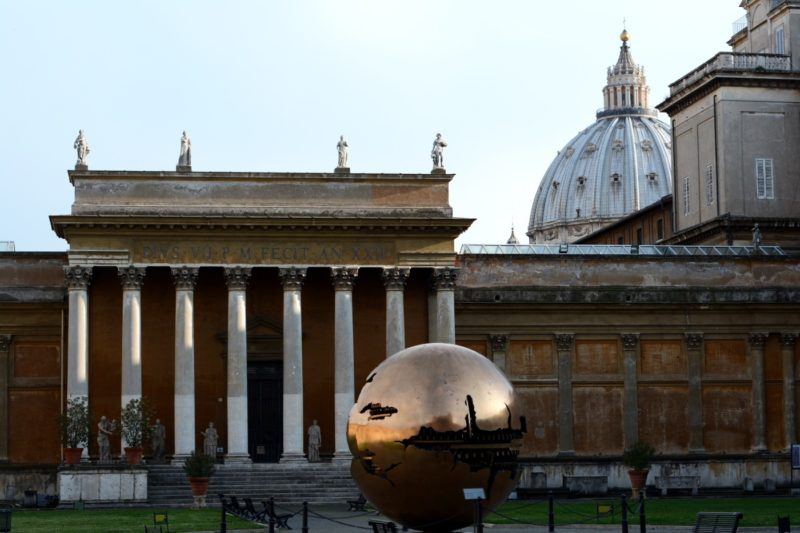 Building and bronze earth sculpture at the Vatican museums