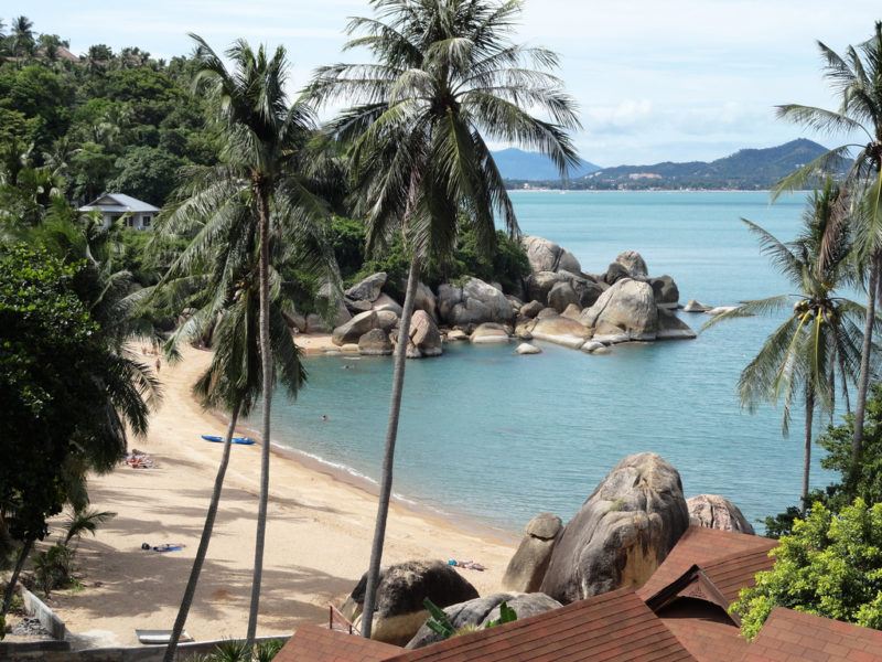 Blue waters and green hills surrounding Lamai Beach on the island of Koh Samui, Thailand