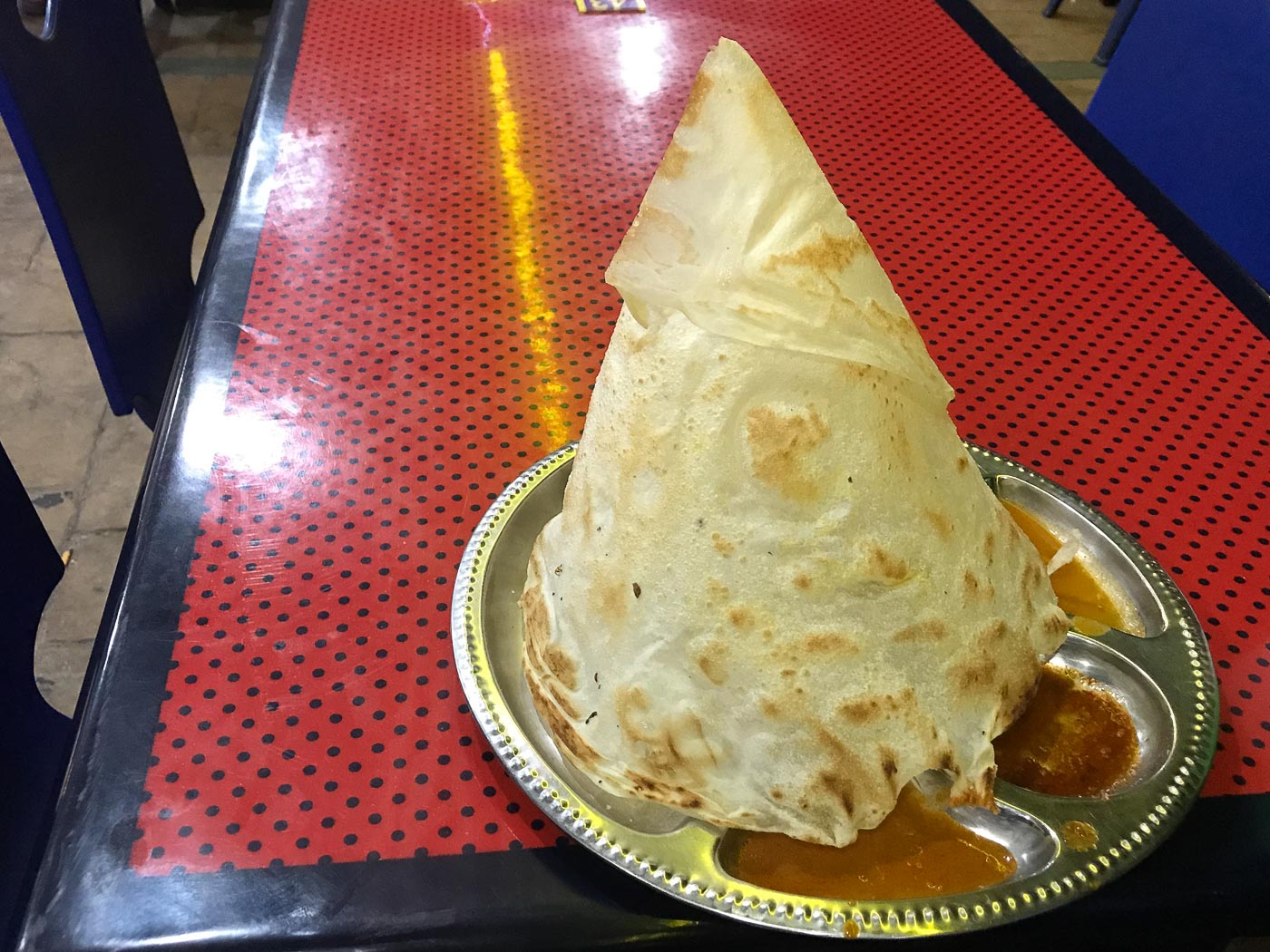 Pyramid shaped roti a top curry sauce - Roti Channi