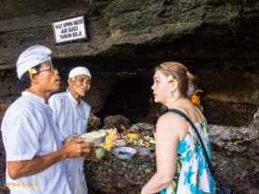 Linda talking with a priest after crossing onto Tanah Lot Temple