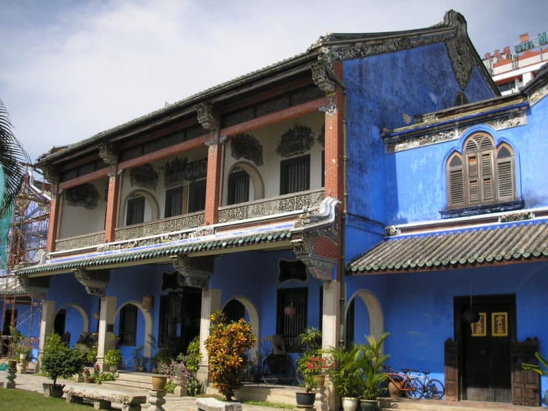 Bright blue paint on the outside of a mansion in central Penang