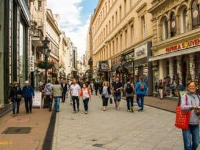 people walking on a pedestrian street and souvenir shop in Budapest