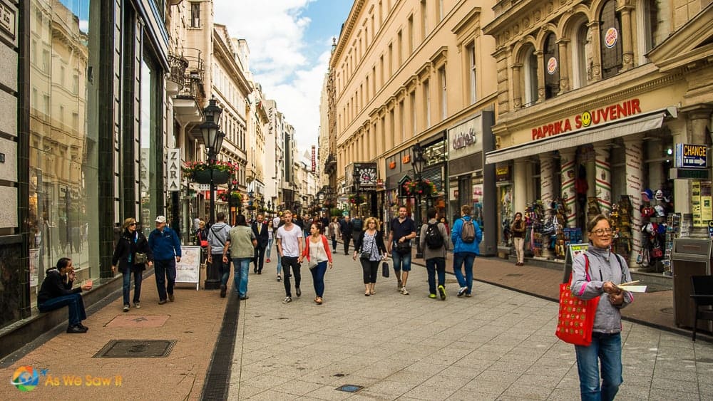 people walking on a pedestrian street and souvenir shop in Budapest