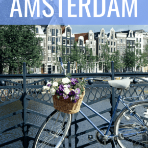 bicycle on bridge canal in amsterdam text says one perfect day in amsterdam