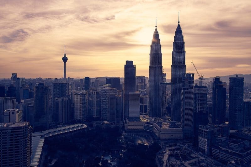 Kuala Lumpur Skyline backlit by sunset sky