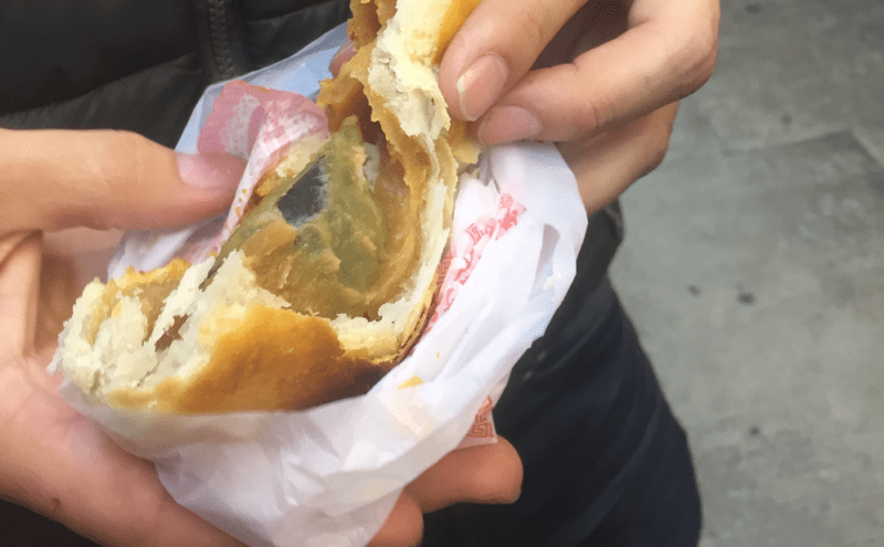 An interior view of a traditional hong kong food known as century old egg, which is wrapped in a pastry shell