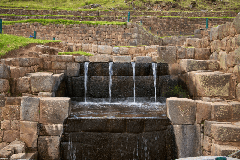 Ancient water channel spillway descends in four streams in Tipon Peru