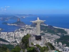 Aerial view of Rio de Janeiro from above and behind the Cristo Redentor statue.