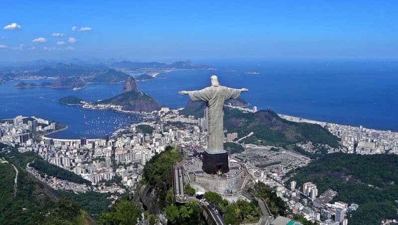 Aerial view of Rio de Janeiro from above and behind the Cristo Redentor statue.