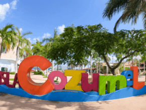 Colorful letters spell out Cozumel on the beach