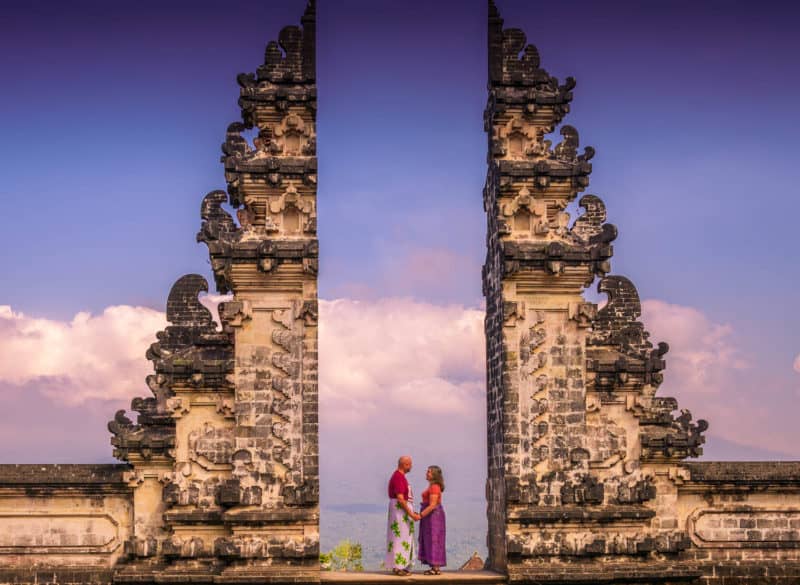 Couple posing at the gate of Pura Lempuyang, one of Bali's 9 directional temples