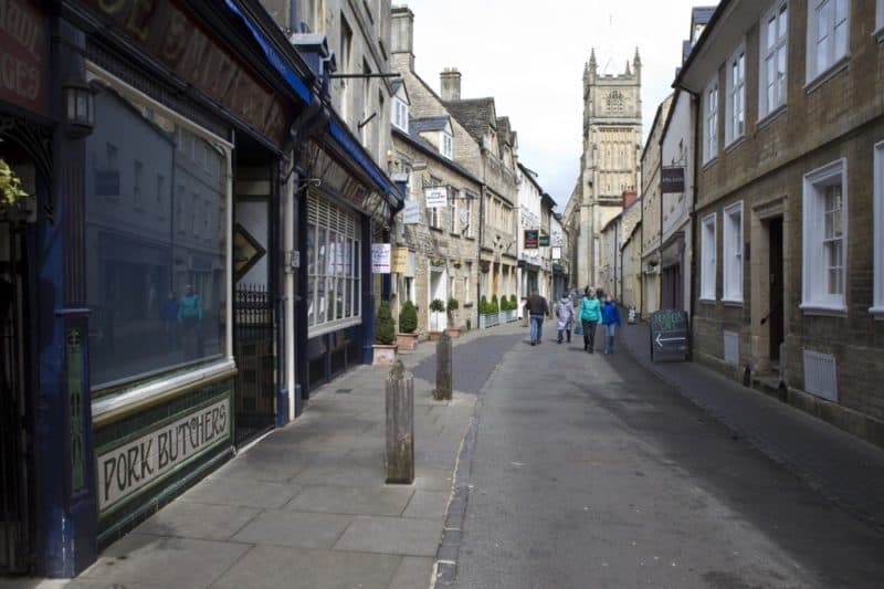 Street in Cirencester with church spire in background