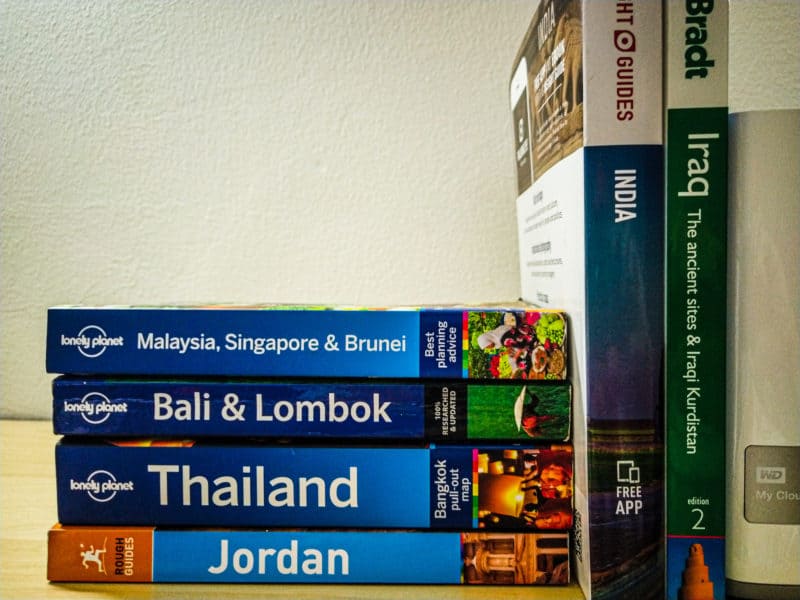 Our collection of guidebooks on our office shelf.