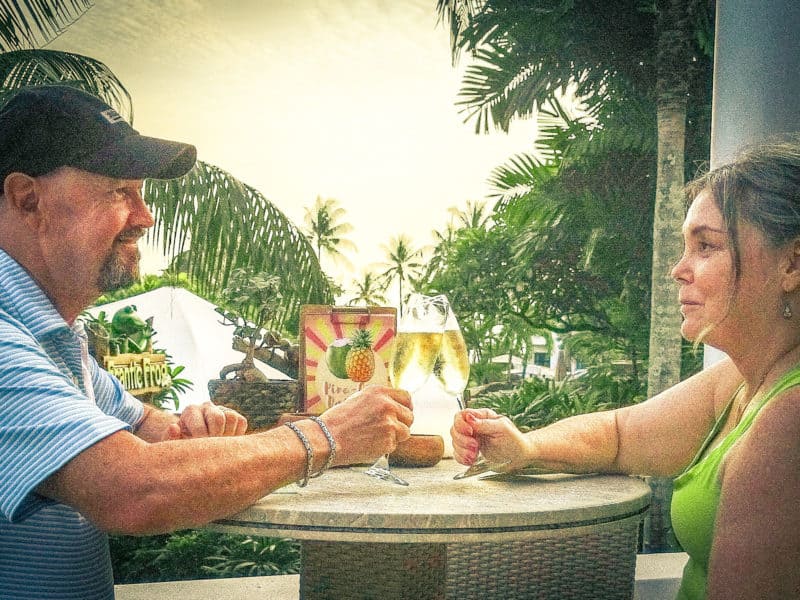 Couple toasting with champagne. Avoiding alcohol is one of the best tips to avoid jet lag