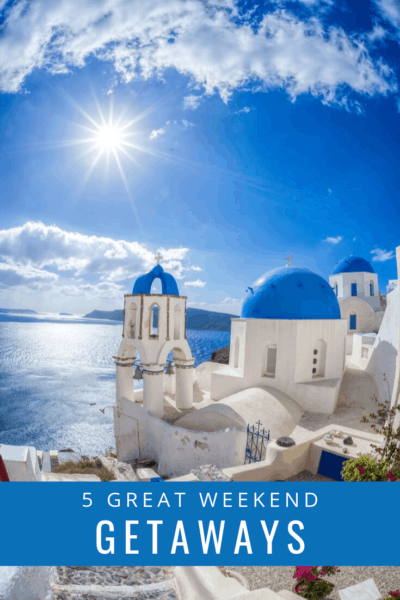 Santorini blue and white houses with text overlay that says 5 great weekend getaways