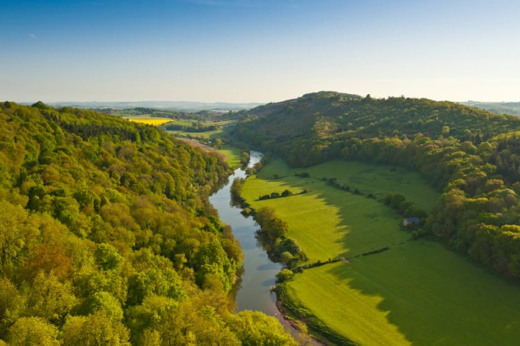green Wye valley with a river running through the center in wales