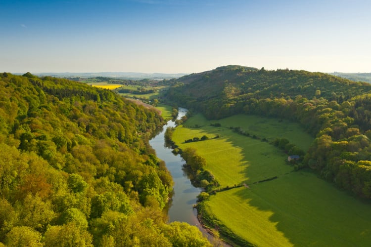 green Wye valley  with a river running through the center in wales