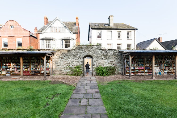 walkway up to hay on wye through an arched opening in wales