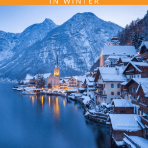 photo of hallstatt in winter with reflection of the city lights in the lake