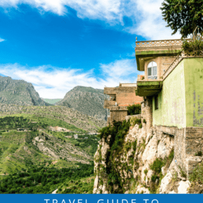 Houses atop a cliff in Amedi Iraq. Text overlay says Travel Guide to Iraqi Kurdistan